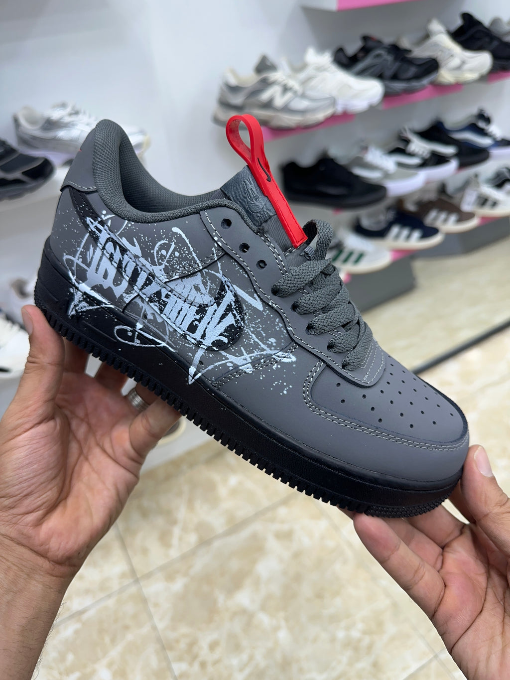 Nike Air Force 1 black white graffiti-style graphic splatter design