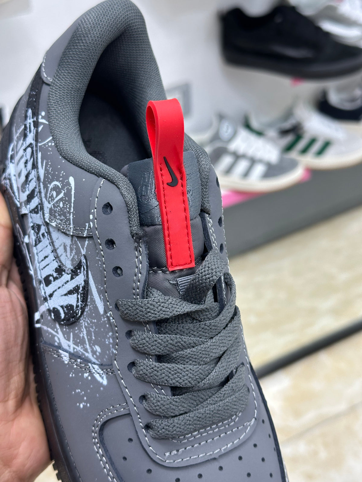 Nike Air Force 1 black white graffiti-style graphic splatter design