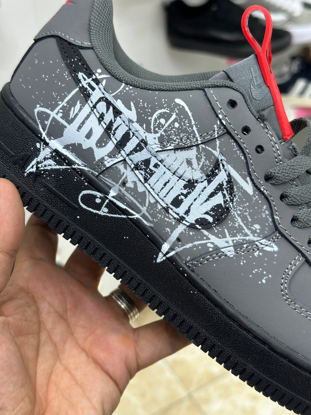 Nike Air Force 1 black white graffiti-style graphic splatter design