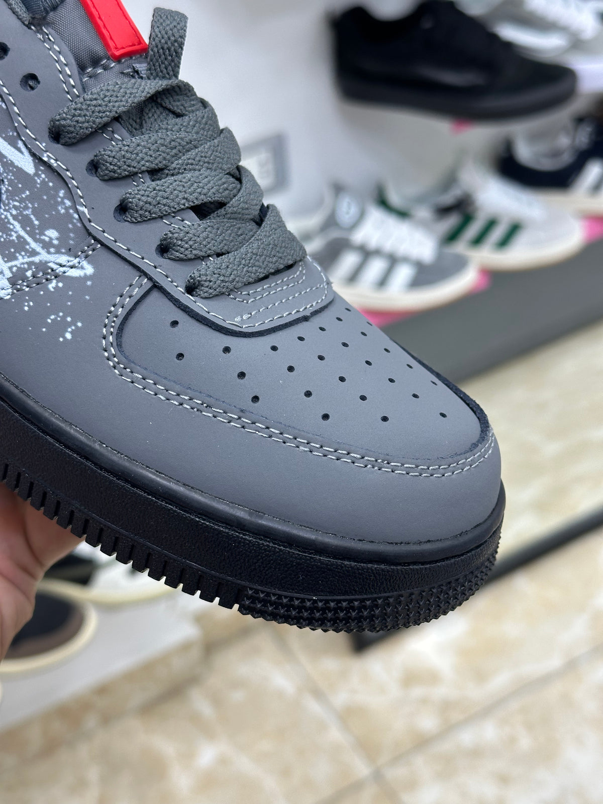 Nike Air Force 1 black white graffiti-style graphic splatter design
